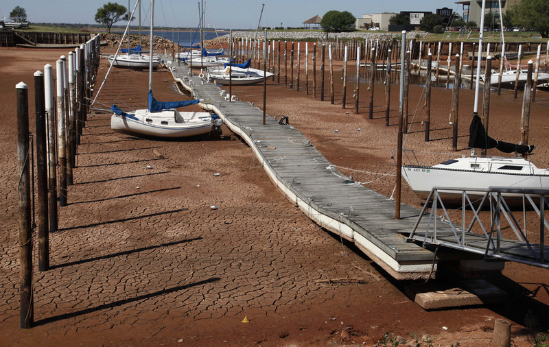 Sailboats sit on the parched floor of Lake Hefner in Oklahoma City last September during a blistering heat wave. Oklahoma averaged 86.9 degrees last summer.