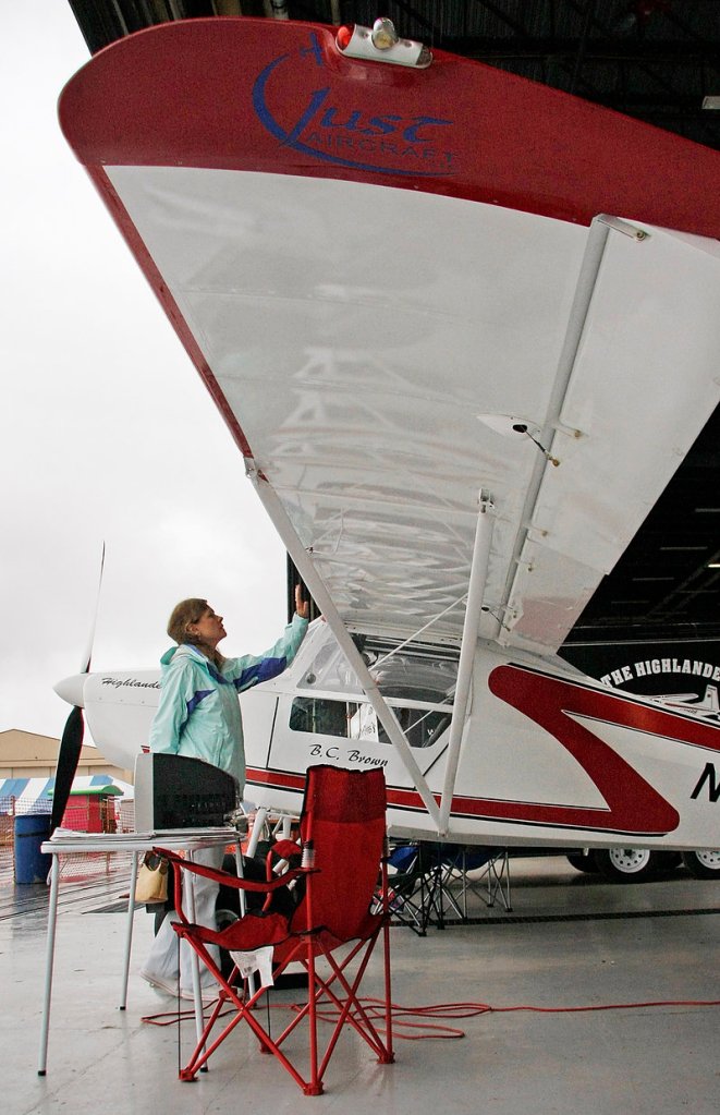 Melissa Niemann of Owls Head examines a Highlander Light Spot experimental aircraft built by Ben Brown of Dixmont at the Brunswick International Fly-In on Saturday.