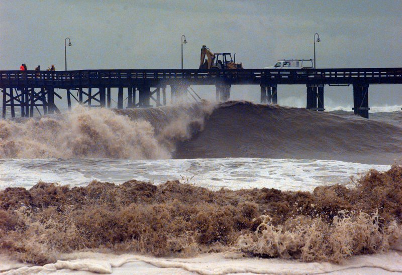 Surf damage is nothing new to Ventura, Calif., residents. In this 1998 photo, work crews repair a damaged pier after a storm struck the Southern California coast.