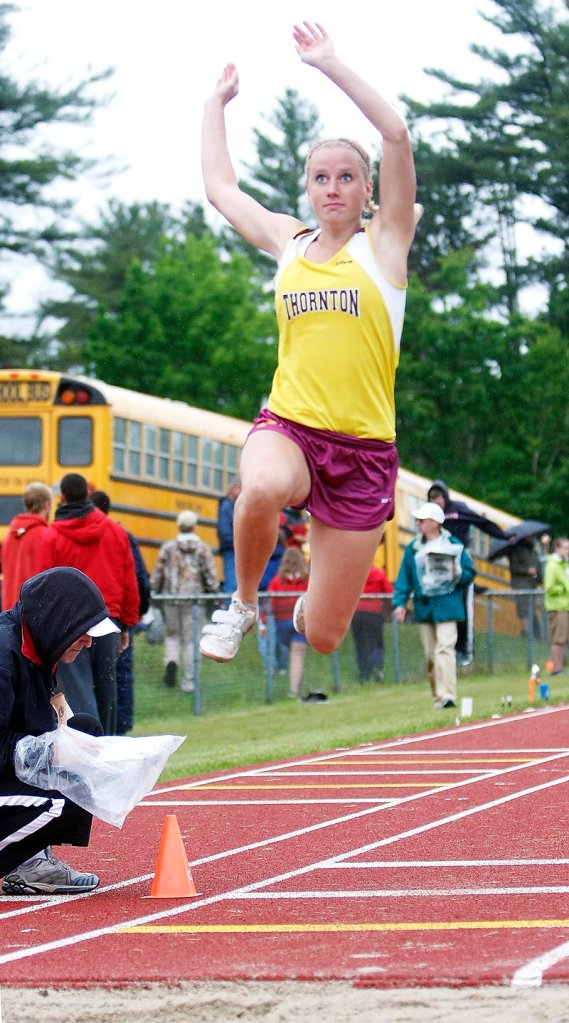 Marie Vermun of Thornton Academy sails into the long jump pit Saturday at the Class A track and field meet. Vermun finished second behind Tiffany Gray of Bangor.