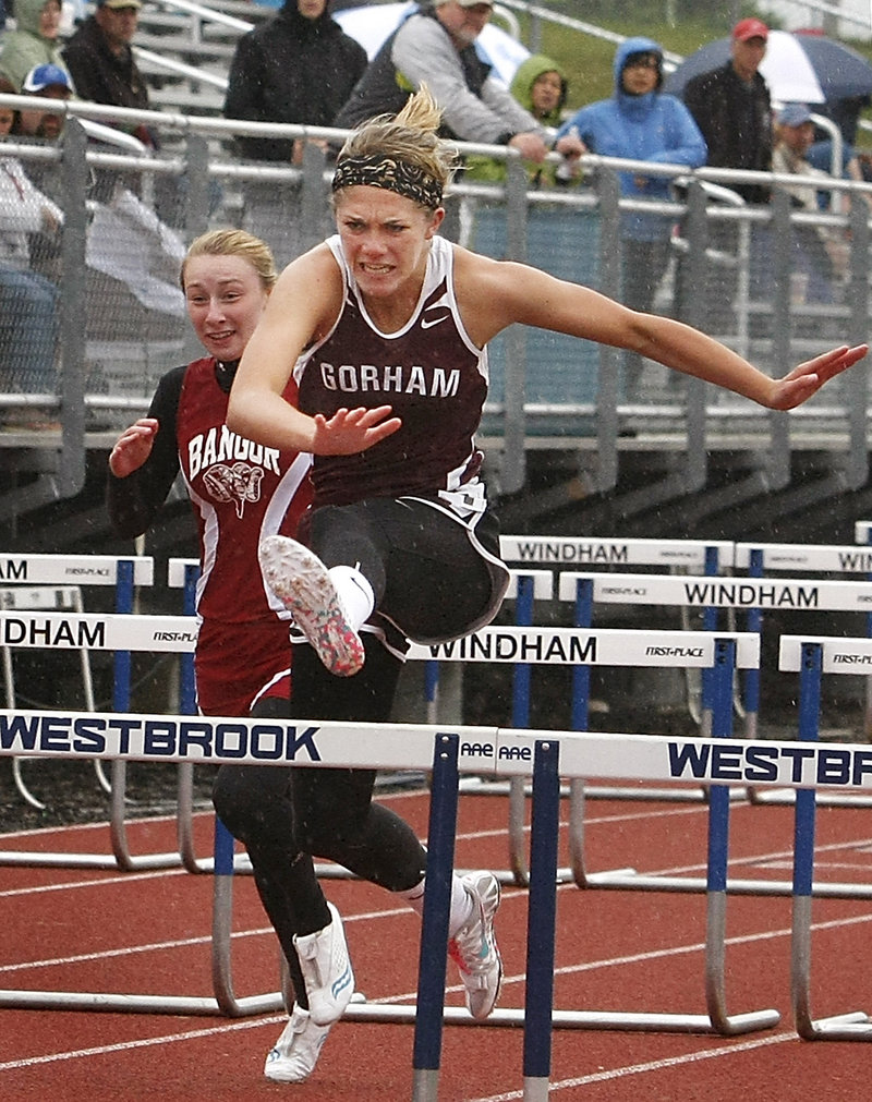 Sarah Perkins of Gorham heads to the finish line Saturday while winning the 100 hurdles in the Class A outdoor track and field championships at Windham High.