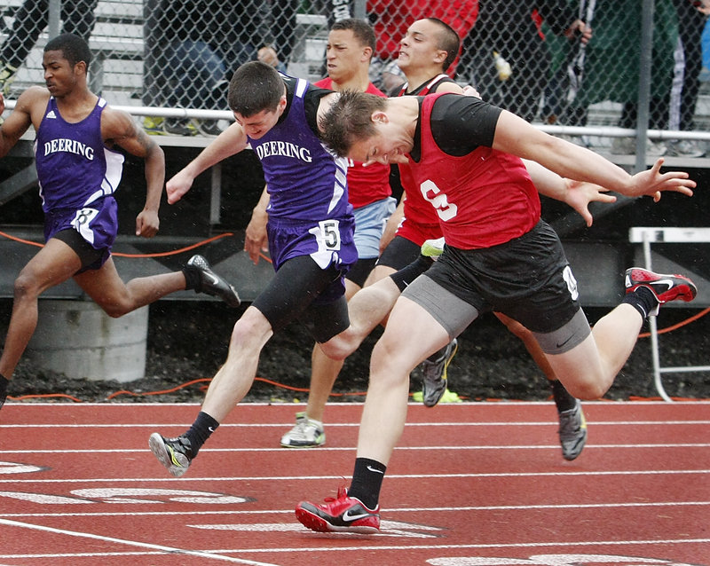 Alex Shain of Sanford puts his head down and wins the 100 in 11.33 seconds, beating Matt Kimball of Deering by less than a half-second – a key win if Sanford takes the state title.