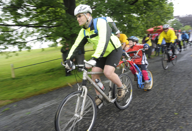 Jason Turner of Limington leads the way with his son Elisha, 5, as riders depart from Wells Reserve at Laudholm Farm.