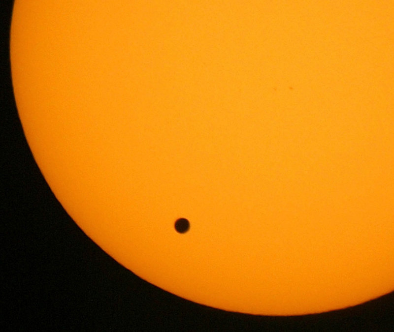 Venus crosses the face of the sun on June 8, 2004. The phenomenon, which will occur again on Tuesday, happens when the planet passes between the Earth and the sun.