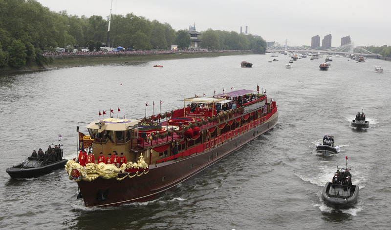 The royal barge, transporting Queen Elizabeth II and her family, approaches Chelsea Bridge in London during the Diamond Jubilee River Pageant on Sunday.