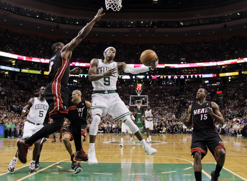 Rajon Rondo drives against Miami’s Dwyane Wade during Game 4 of the Eastern Conference finals Sunday night in Boston. Rondo scored 15 points – including the final three in overtime – and added 15 assists as the Celtics evened the series with a 93-91 victory.