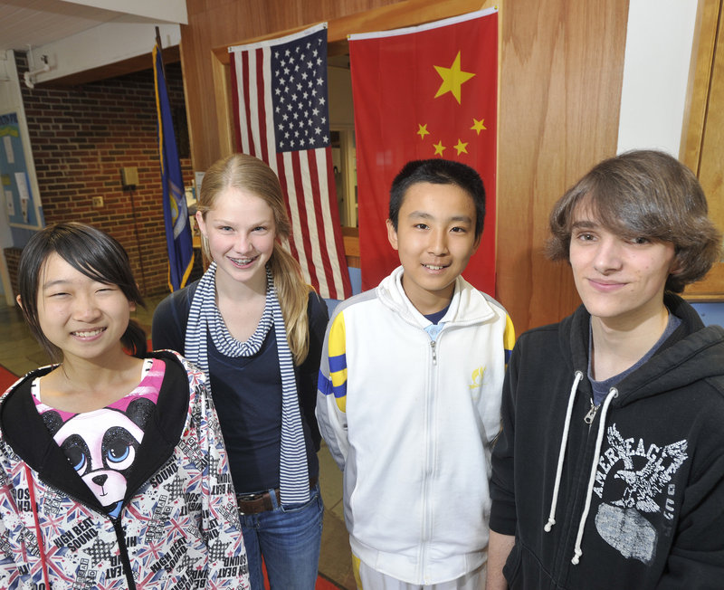 Falmouth student hosts Ben Stimson, right, and Emma Walsh, second from left, stand with their guests, Wang Jinyuan, left, and Geng Haoran. The Chinese students will also visit L.L. Bean in Freeport and Bowdoin College in Brunswick.