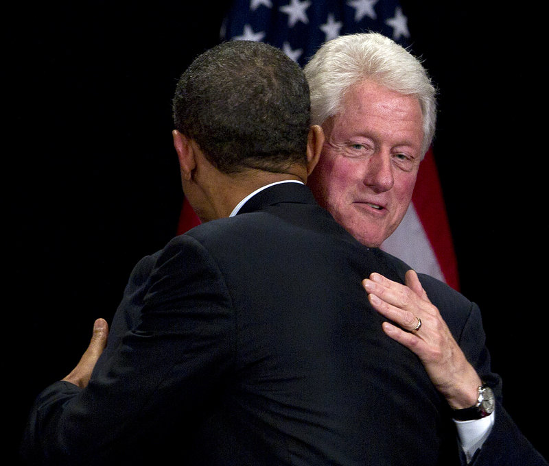 Former President Clinton greets President Obama at a campaign fundraising event in New York on Monday.