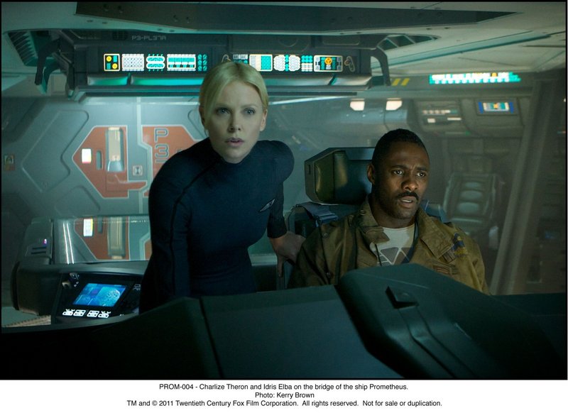 Charlize Theron and Idris Elba on the bridge of the ship Prometheus.