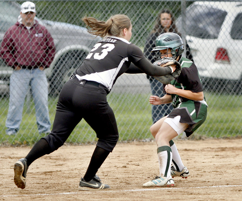 Heather Fecteau of Biddeford tags out Danielle Day, who was trying to score on a bunt for Bonny Eagle in the sixth inning.