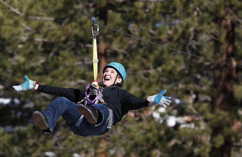 Andrea Grieve celebrates her third wedding anniversary by ziplining in Big Bear, Calif. Zip lines have become such a boom industry, particularly in California, that a private group is setting new voluntary safety standards.