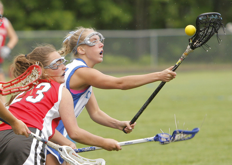 Lauren Errico of Kennebunk recovers the ball during a battle for control against Marty Bushey of South Portland during Kennebunk’s 12-5 victory Wednesday.