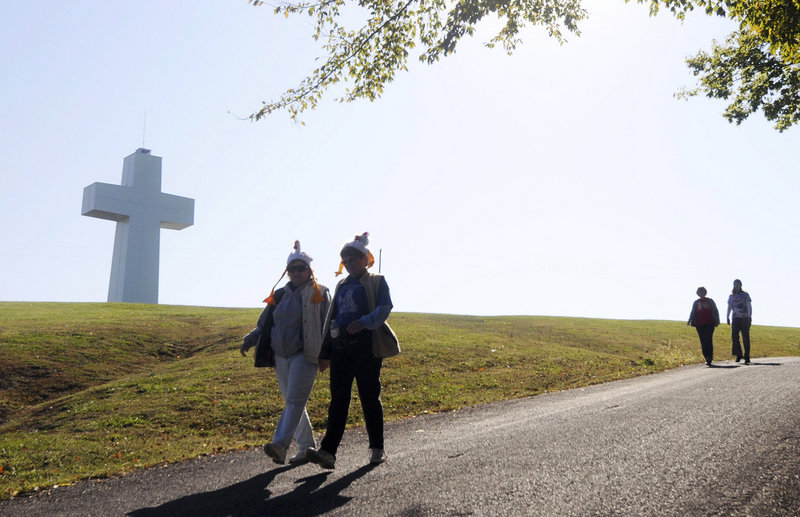 Visitors walk past the 111-foot-high Bald Knob Cross of Peace near Alto Pass, Ill.