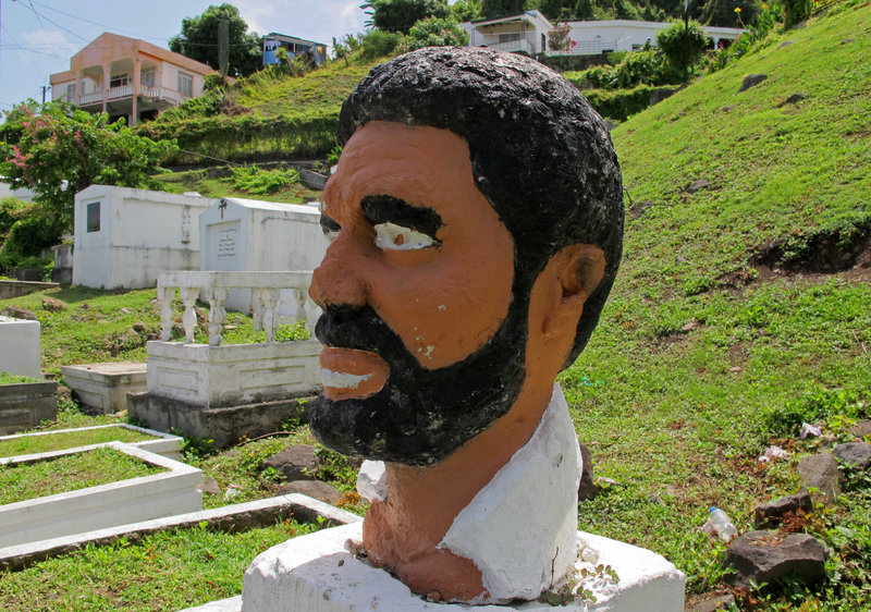 A bust of Grenada’s former Prime Minister Maurice Bishop occupies a corner of a sprawling hillside cemetery where forensic experts believe the executed leader’s body was buried in an unmarked grave in 1983 in St. George’s, Grenada.