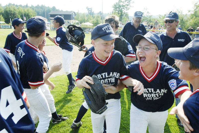 Luke Boyle and Tyler Wiggin and their Portland North Little League team celebrate their state championship victory over Lincoln County in 2007. Coach Ron Farr stands in the background. In two weeks, Farr will coach a Portland North all-star team for the 13th consecutive year.