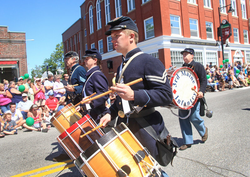 Members of Company A, 3rd Maine Regiment Volunteer Infantry fill the air with music.