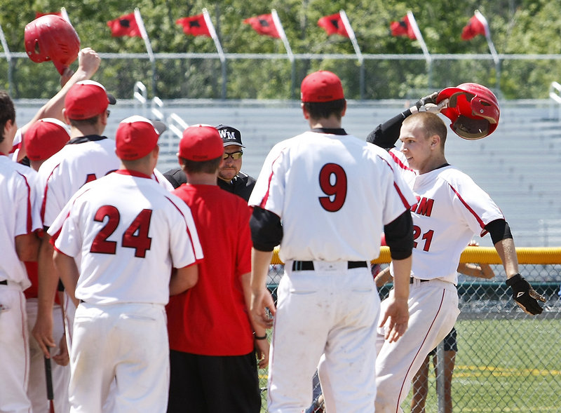 Ben Wessel is greeted by his Scarborough teammates Saturday after hitting a three-run homer in the fifth inning of the 7-0 victory over Windham. The Red Storm will meet Cheverus for the Western Class A title.