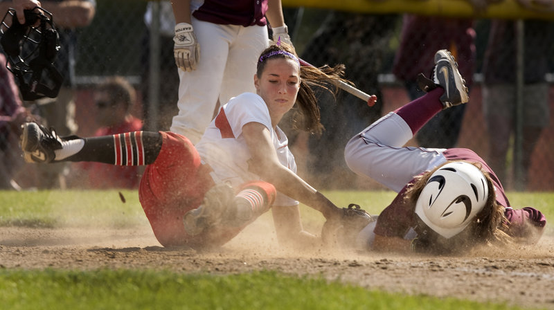 South Portland pitcher Erin Bogdanovich tags out Thornton’s Sam Schildroth, who was trying to score on a passed ball. South Portland advanced to the regional final with an 8-1 win.