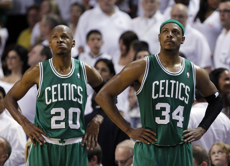 Ray Allen, left, and Paul Pierce of the Boston Celtics can do little more than watch the moments tick away on their time together with a loss to the Heat in Game 7.