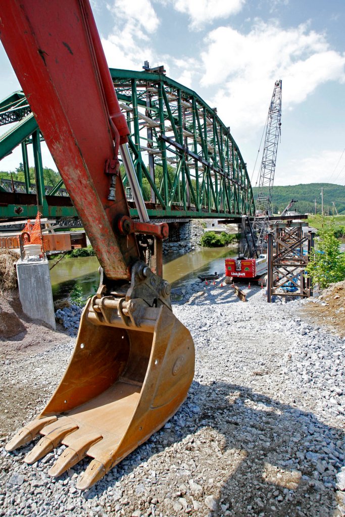 The Checkered House Bridge is under construction in Richmond, Vt. Engineers will separate the sides, move one 300,000-pound truss 10 feet away from the other and then reattach the sides.