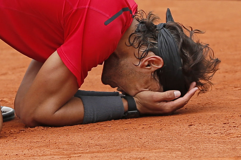 Rafael Nadal of Spain savors the moment Monday after winning the men’s final match against Novak Djokovic of Serbia at the French Open in Paris. “When you lose, it’s because you don’t deserve the title,” he said. “So in my mind, this was the final I had to win. That’s why I was so emotional.”
