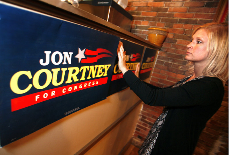 Megan Sanborn, Jon Courtney’s stepdaughter, prepares for his primary night party at Pat’s Pizza in Portland. The near-final vote was 14,547 to 14,282, Courtney over Patrick Calder.