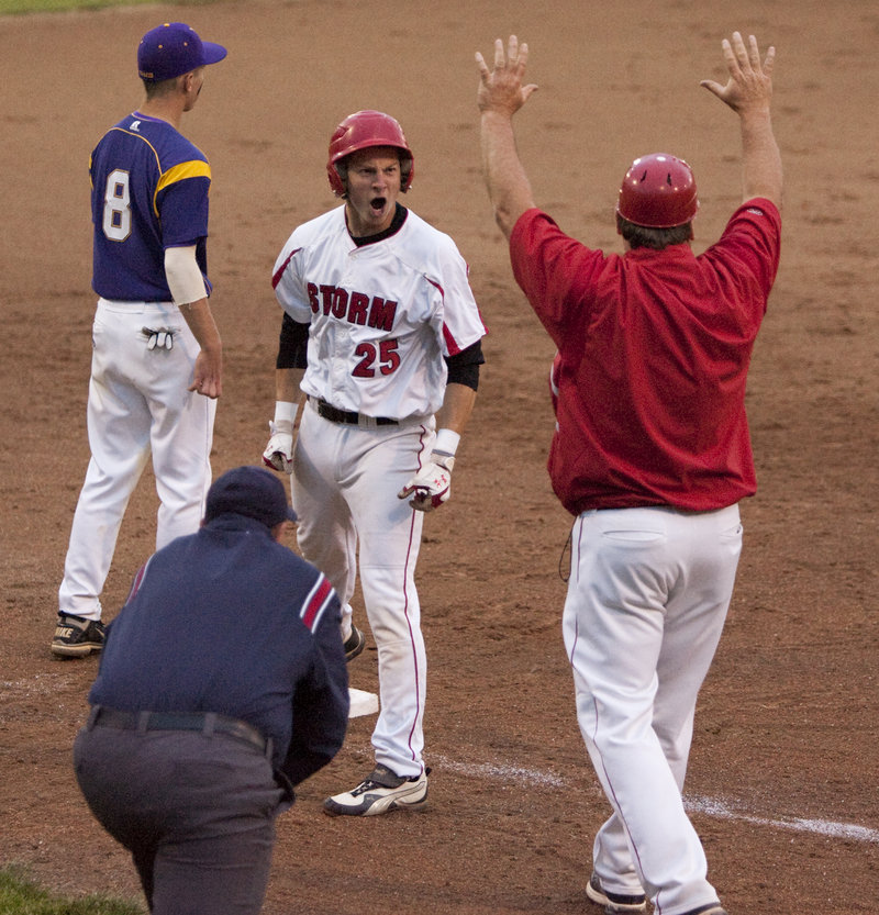 Ben Greenberg of Scarborough celebrates on third base Tuesday night after hitting a leadoff triple in the fifth inning. Greenberg then scored on a sacrifice fly by Aaron Ravin.