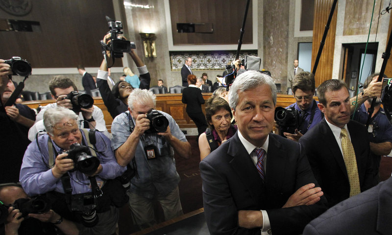 JPMorgan Chase CEO Jamie Dimon arrives on Capitol Hill Wednesday to testify before the Senate Banking Committee.