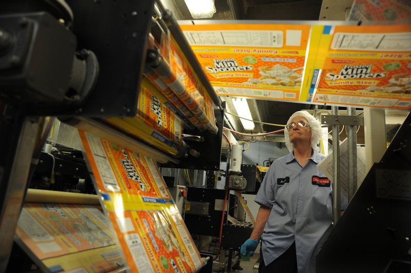 Joann Flicek keeps an eye on a Frosted Mini Spooners bagging machine at MOM Brands, formerly known as Malt-O-Meal. From 2001 to 2011, the company’s annual sales climbed from $300 million to about $750 million.