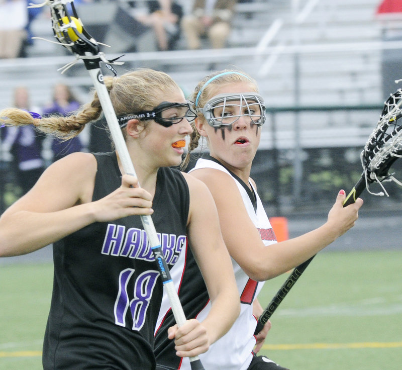 Korinne Bohunsky, left, of Marshwood is chased by Kat Gadbois of Scarborough during their Western Class A final. Scarborough will meet Cheverus or Brunswick, who play today, in the state championship game.