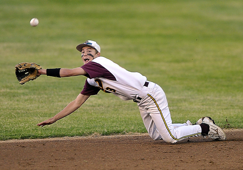 Cape Elizabeth second baseman Matty Pierce dives to spear a line drive in the seventh inning Thursday against Falmouth. The catch preserved pitcher Sam Kozlowski’s no-hitter, but Falmouth got an unearned run in the eighth inning and captured the Western Class B title with a 1-0 victory.