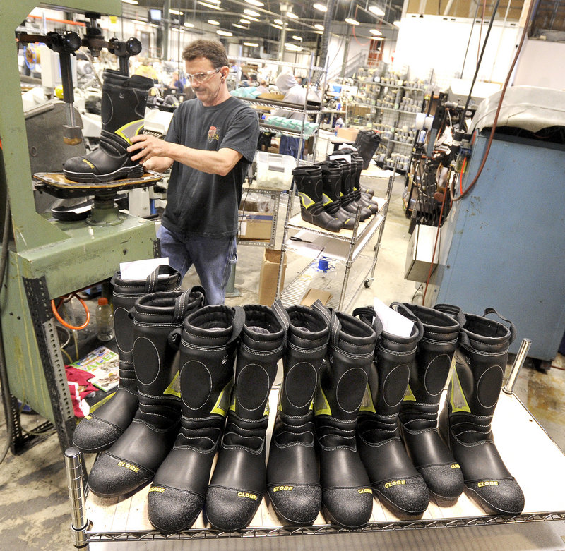 Rick Nedeau prepares boots to be soled at Falcon Performance Footwear in Auburn.