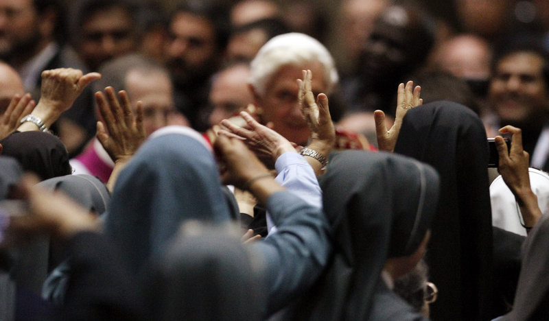 Pope Benedict XVI is greeted by nuns during a meeting with priests and religious in Milan, Italy, on June 2. Benedict has been trying to restore Catholic traditions he believes were lost 50 years ago in the modernizing reforms of the Second Vatican Council.
