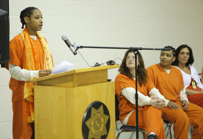 Regina Goins reads her story “Strengthen Oneself” at the Cumberland County Jail on Friday. A dozen women participated in the jail’s Sister Stories writing program.