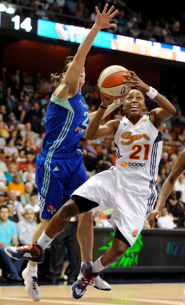 Renee Montgomery of the Connecticut Sun drives against Kelly Miller of the New York Liberty during Connecticut’s 97-55 rout.