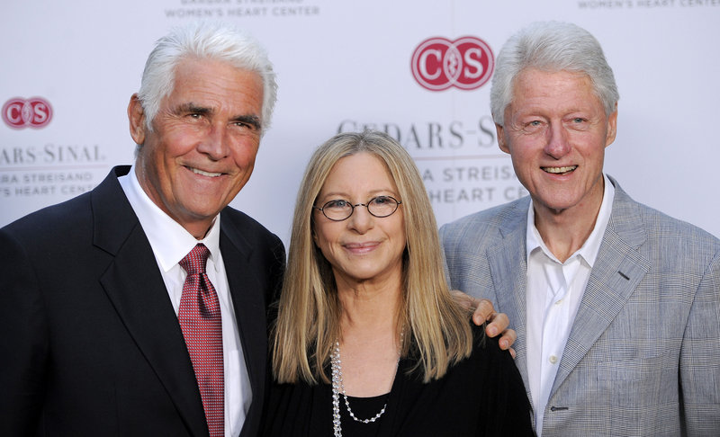 Former President Clinton, right, poses with Barbra Streisand and her husband, James Brolin, on Thursday at Streisand’s oceanfront compound in Malibu, Calif.