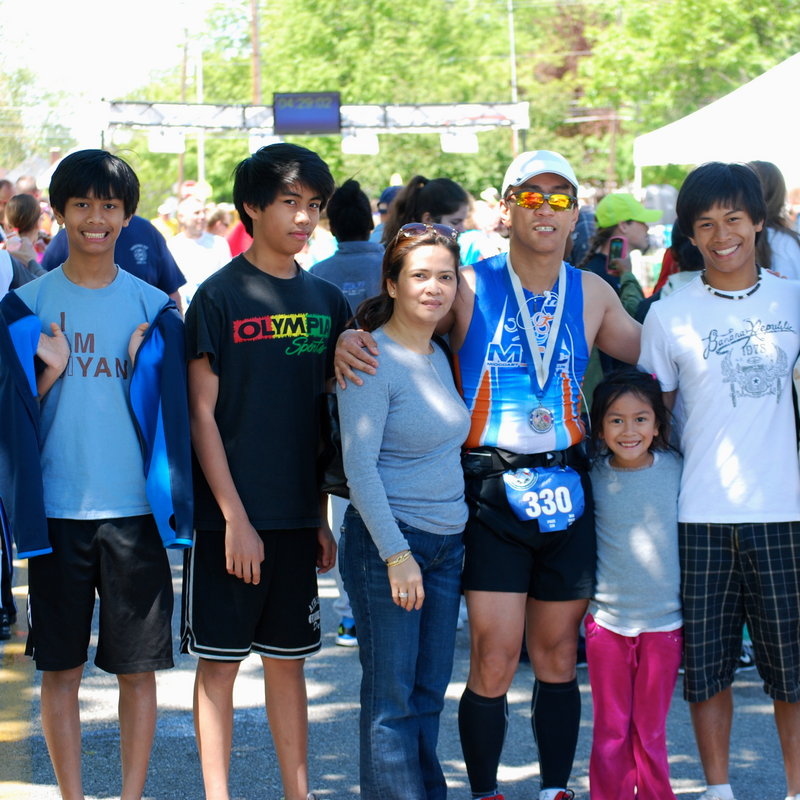 Dr. Aquilino Alamo of Boothbay Harbor, wearing sunglasses, and family, from left, Kyle, Karl, wife Chat, Ariel and Jude, celebrate his finish at the Gettysburg North-South Marathon in April.