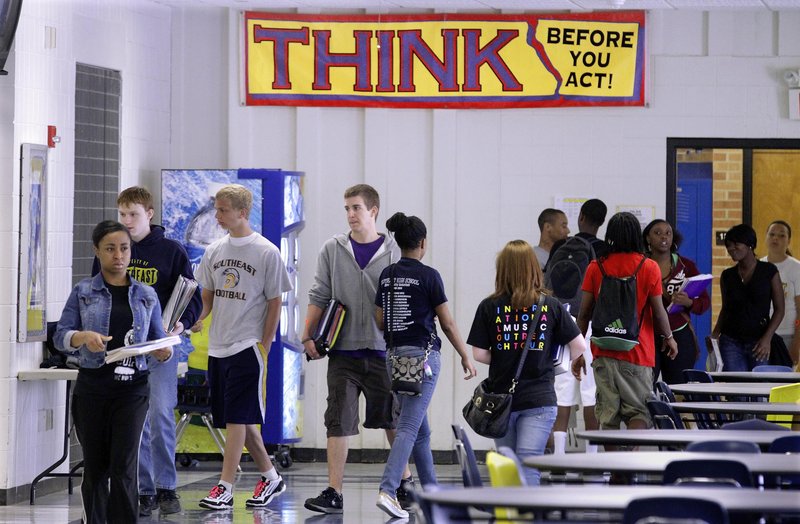 Springfield Southeast High School students change classes in Springfield, Ill., in May. The Illinois governor proposed raising the dropout age to 18, but no action has been taken.