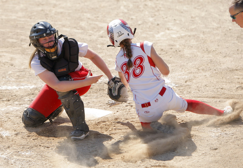 South Portland catcher Sam DiBiase tags out Nicole Rugan of Cony during the Class A softball championship game. Cony finished a 22-0 season with a 2-0 victory.