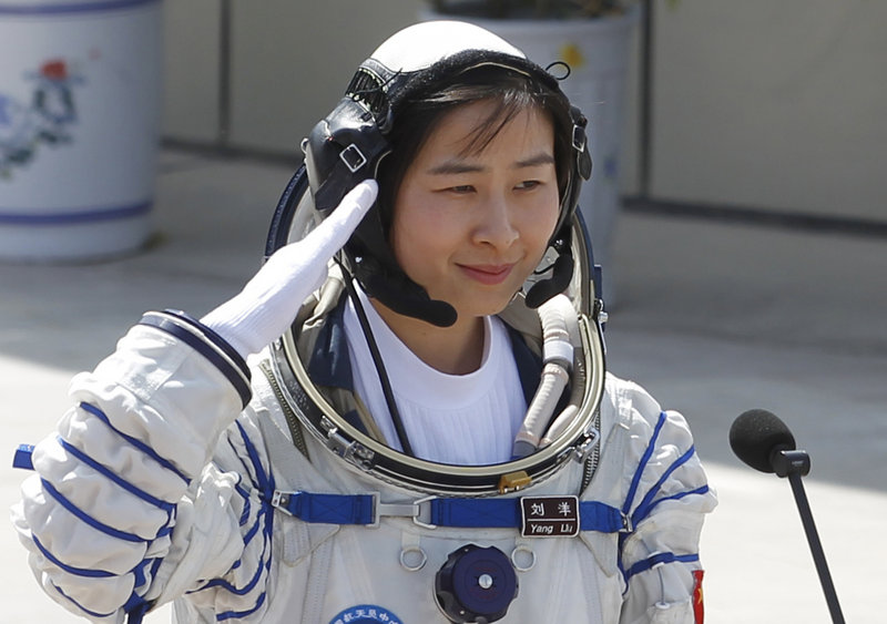 Liu Yang, China’s first female astronaut, departs for the launch pad at the Jiuquan Satellite Launch Center in Jiuquan on Saturday.