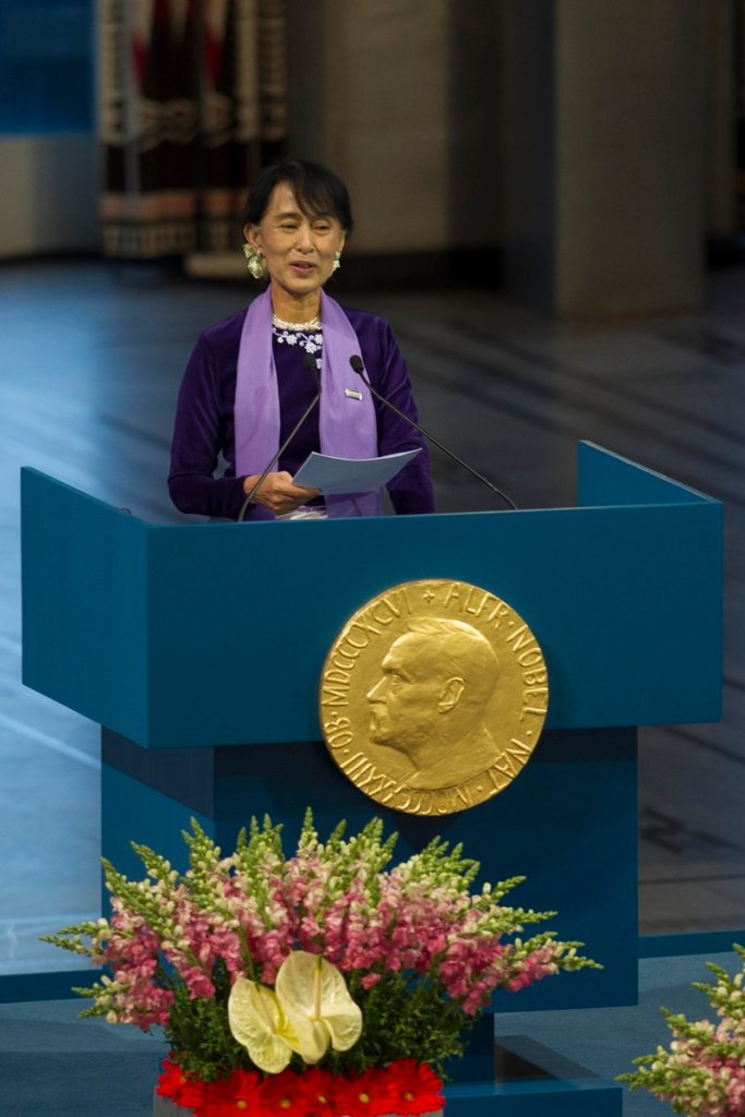Myanmar opposition leader Aung San Suu Kyi gives her Nobel Peace Prize speech at the city hall in Oslo on Saturday as she formally accepts the prize that thrust her into the global spotlight two decades ago.