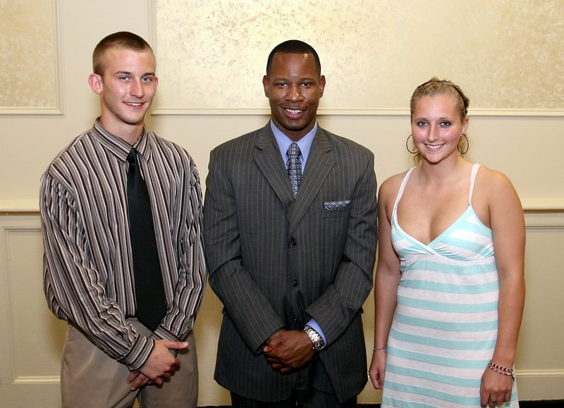 Nate Doehler, left, and Stephanie Whitten, 2009 Portland Press Herald/Maine Sunday Telegram Athletes of the Year, share the moment with guest speaker Wil Smith at the 2009 award ceremony.