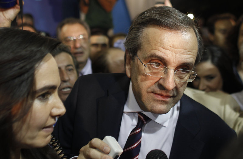 Antonis Samaras, leader of the New Democracy conservative party, speaks to supporters in Athens on Sunday. His party is likely to stick to austerity measures.