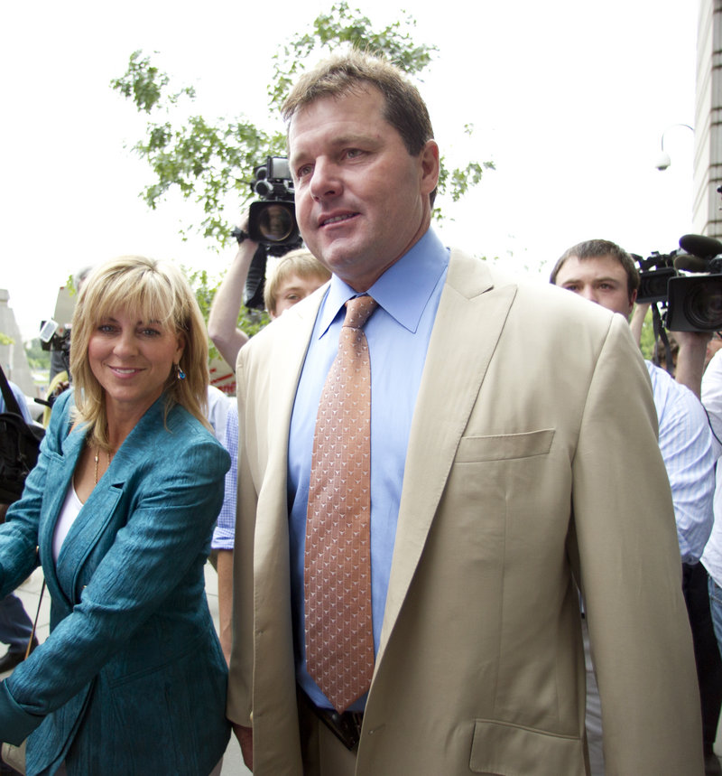 Former Major League Baseball pitcher Roger Clemens and his wife, Debbie, walk outside federal court in Washington on Monday. He was acquitted on charges of lying to Congress in 2008, when he denied ever using performance-enhancing drugs.