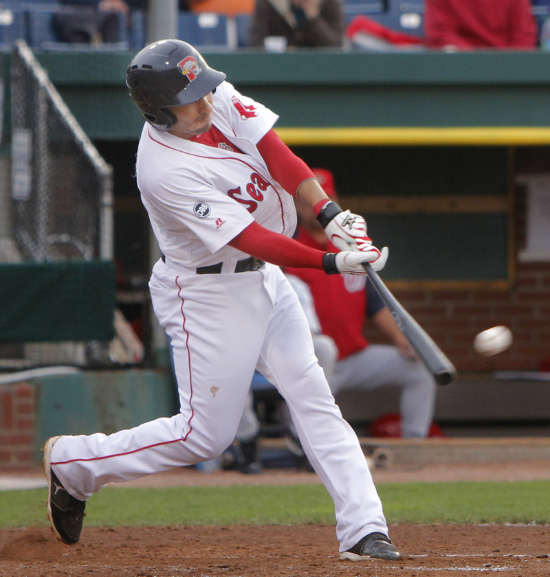 Ryan Dent, who collected three hits Tuesday night for the Sea Dogs, strokes a single during a nine-run fourth inning that carried Portland to a 14-0 victory against the Harrisburg Senators at Hadlock Field.