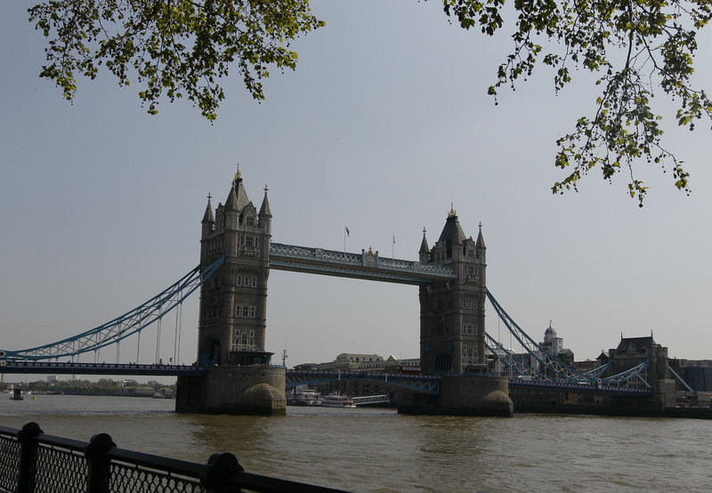 Tower Bridge is seen from near a cycle path in London. One route to Olympic Park starts at the Tower of London on the north side of the Thames River. It passes by historic port pubs such as The Prospect of Whitby, once home to sailors, smugglers and cutthroats.