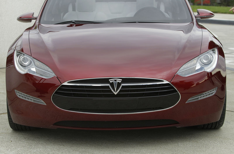The Tesla Model S electric sedan is unveiled in October 2010 at the company’s factory in Fremont, Calif. The Model S carries a starting price of $49,900 after a federal tax credit, about the same as a Lexus RX hybrid crossover.