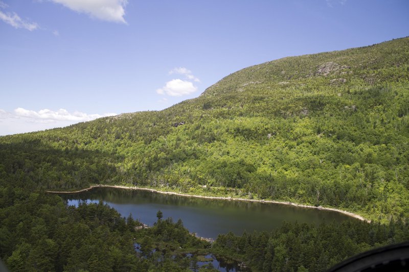 Remote Black Mountain Pond in Sandwich, N.H., is seen from a helicopter just before it lands so state wildlife officials can stock the waters with fingerling brook trout.
