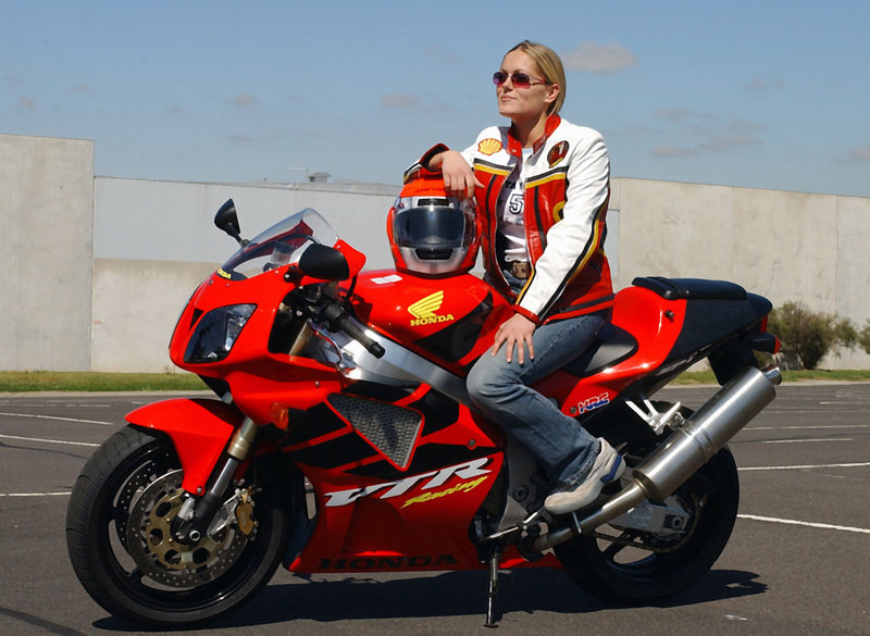 Katja Poensgen, a German motorcycle racer, rides a 250-cc Honda. Manufacturers report high demand from female riders looking to buy scaled-down, easy-to-control motorcycles for everyday use.