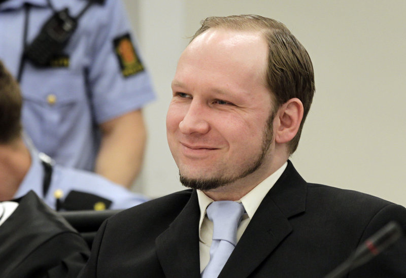 Anders Behring Breivik, the confessed killer of 77 people in Norway last year in a bombing and shooting rampage, reacts as prosecutors give closing arguments in Oslo on Thursday.